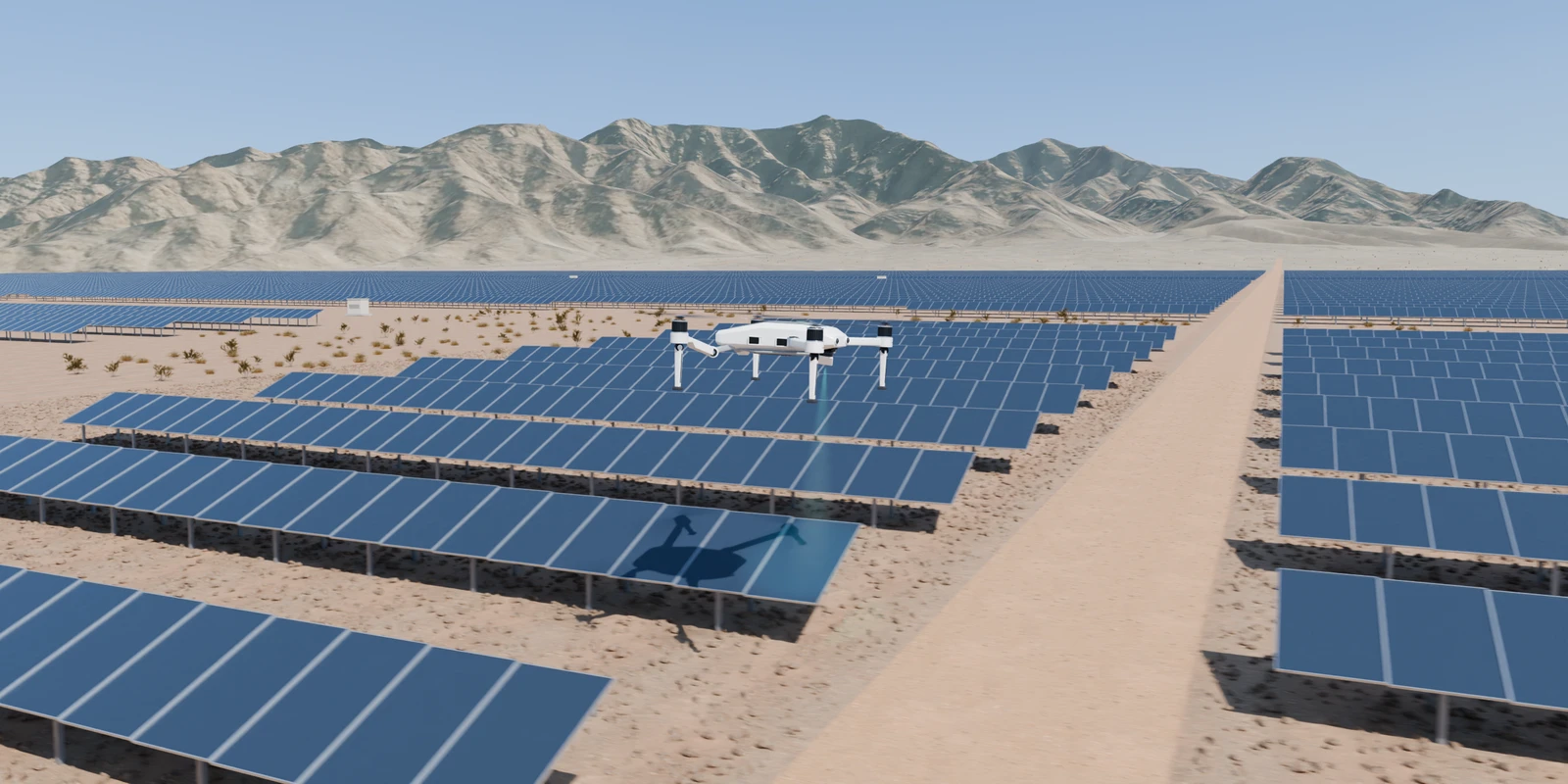 The white HawkWorks drone inspecting tilted solar panels over detailed desert ground, with dry mountain terrain beyond the farm.